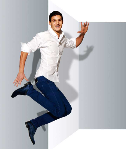 Jumping man in white shirt and blue jeans